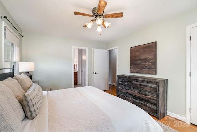 5329 Glenbrier Dr, Charlotte, NC 28212 - bedroom featuring wood finished floors, baseboards, ceiling fan, and connected bathroom