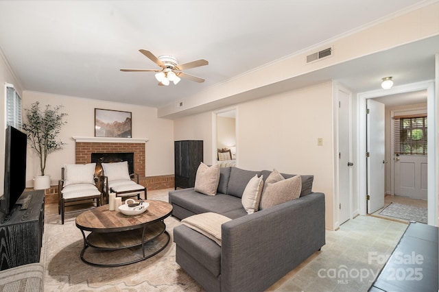 5329 Glenbrier Dr, Charlotte, NC 28212 - living area featuring a ceiling fan, ornamental molding, and a brick fireplace