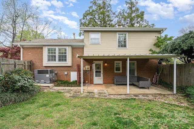5329 Glenbrier Dr, Charlotte, NC 28212 - rear view of property featuring central air condition unit, a patio, outdoor lounge area, and brick siding