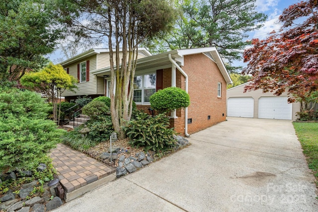 5329 Glenbrier Dr, Charlotte, NC 28212 - view of front facade with brick siding, a detached garage, an outbuilding, and crawl space
