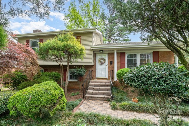 5329 Glenbrier Dr, Charlotte, NC 28212 - split level home with brick siding and a chimney