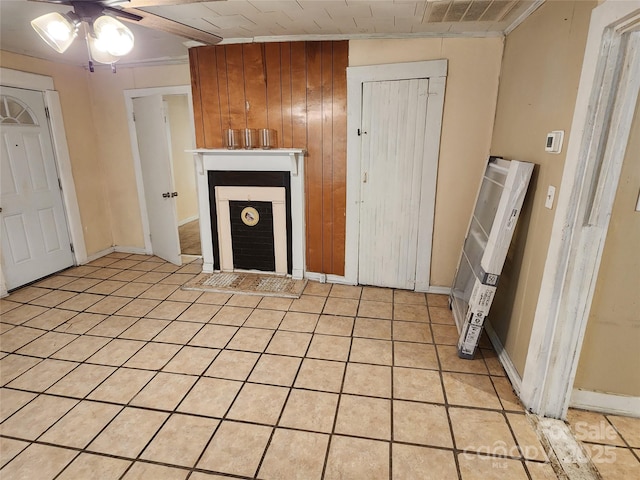 unfurnished living room featuring light tile patterned floors, visible vents, and ceiling fan