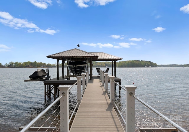 view of dock with a water view and boat lift