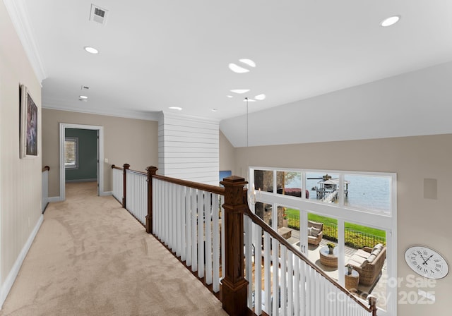 corridor with carpet, recessed lighting, ornamental molding, and baseboards