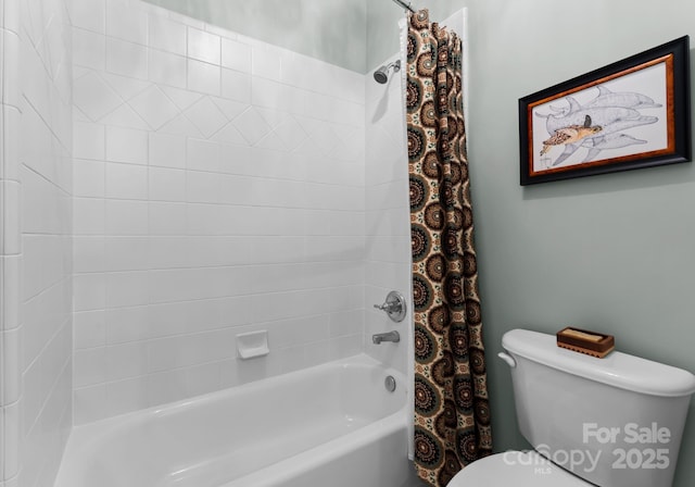 full bath featuring shower / bath combo with shower curtain and toilet