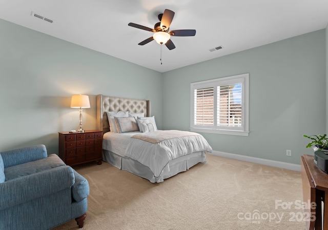 bedroom featuring baseboards, visible vents, a ceiling fan, and carpet floors
