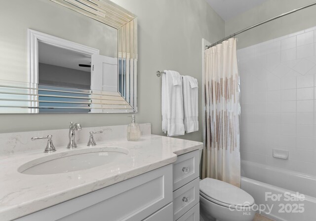 full bathroom with toilet, shower / tub combo, and vanity