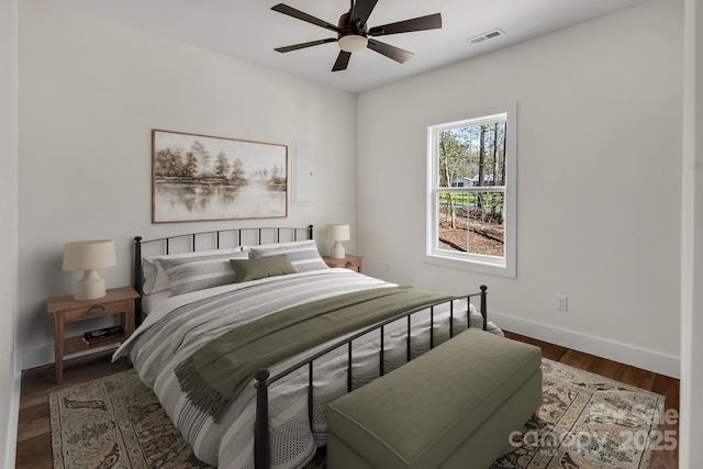 676 Chapel Hill Dr, Troy, NC 27371 - bedroom with baseboards, wood finished floors, and ceiling fan