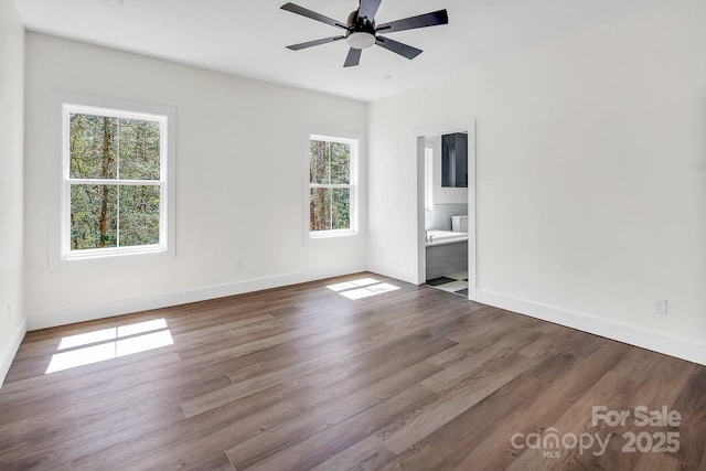 676 Chapel Hill Dr, Troy, NC 27371 - spare room featuring plenty of natural light, wood finished floors, and a ceiling fan