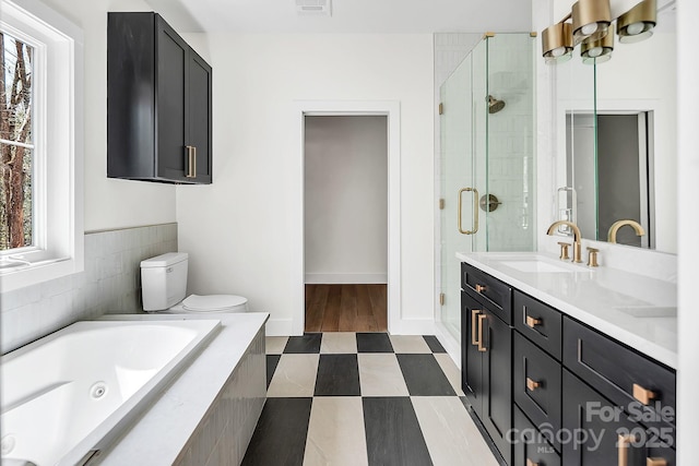 676 Chapel Hill Dr, Troy, NC 27371 - bathroom featuring a stall shower, a tub with jets, double vanity, toilet, and tile patterned flooring