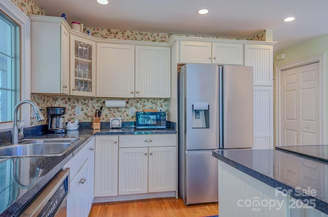 161 Hamburg Mountain Rd, Weaverville, NC 28787 - kitchen with stainless steel fridge, a sink, dishwashing machine, black microwave, and dark stone countertops