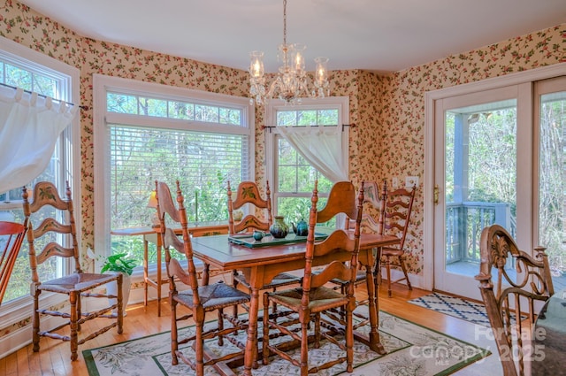 161 Hamburg Mountain Rd, Weaverville, NC 28787 - dining area featuring wallpapered walls, plenty of natural light, light wood finished floors, and a chandelier