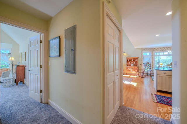 161 Hamburg Mountain Rd, Weaverville, NC 28787 - corridor featuring light carpet, electric panel, baseboards, recessed lighting, and light wood-type flooring