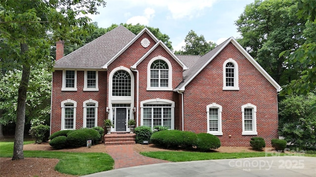 101 Saddletree Rd, Lincolnton, NC 28092 - colonial home featuring a chimney, brick siding, and roof with shingles