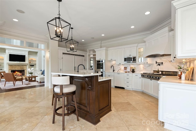 325 Ivy Arbor Cir, Rock Hill, SC 29732 - kitchen featuring appliances with stainless steel finishes, light countertops, ornamental molding, a breakfast bar, and white cabinetry