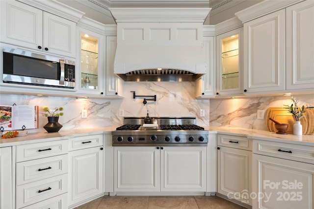 325 Ivy Arbor Cir, Rock Hill, SC 29732 - kitchen with appliances with stainless steel finishes, light countertops, white cabinetry, and ornamental molding