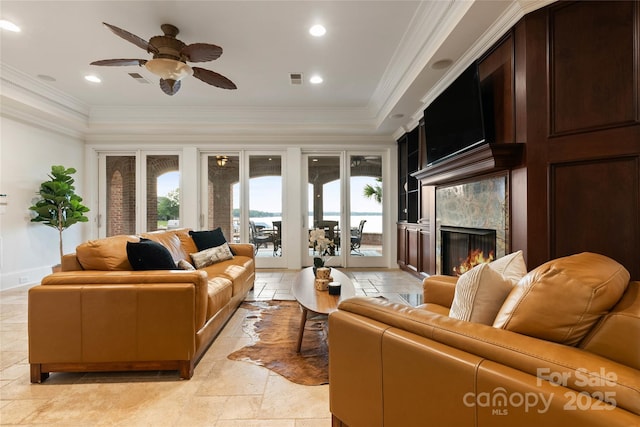 325 Ivy Arbor Cir, Rock Hill, SC 29732 - living room with ceiling fan, a premium fireplace, crown molding, recessed lighting, and stone tile flooring