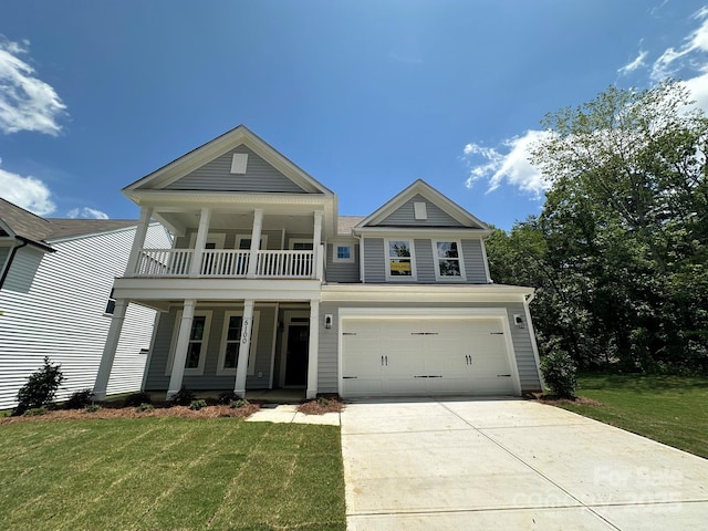 5100 Verona Rd Unit 96, Charlotte, NC 28213 - view of front of house with a balcony, covered porch, an attached garage, and a front lawn