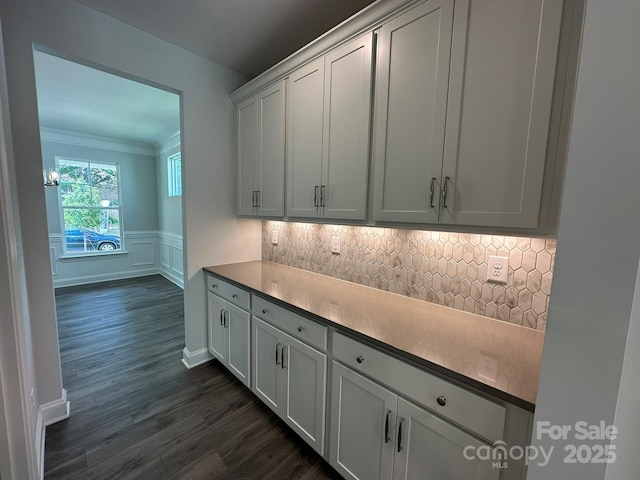 5100 Verona Rd Unit 96, Charlotte, NC 28213 - kitchen featuring dark wood-style flooring, tasteful backsplash, wainscoting, ornamental molding, and white cabinets