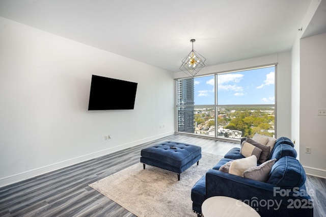 333 W Trade St Unit 1802, Charlotte, NC 28202 - living area with baseboards, dark wood-type flooring, and a notable chandelier