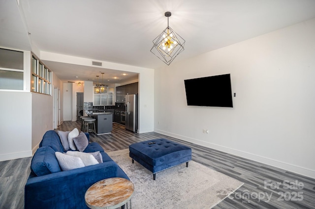 333 W Trade St Unit 1802, Charlotte, NC 28202 - living room featuring baseboards, dark wood-style floors, visible vents, and a chandelier