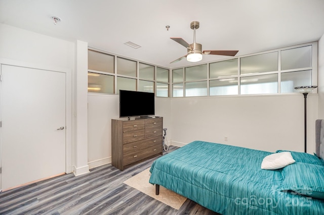 333 W Trade St Unit 1802, Charlotte, NC 28202 - bedroom with baseboards, visible vents, wood finished floors, and a ceiling fan