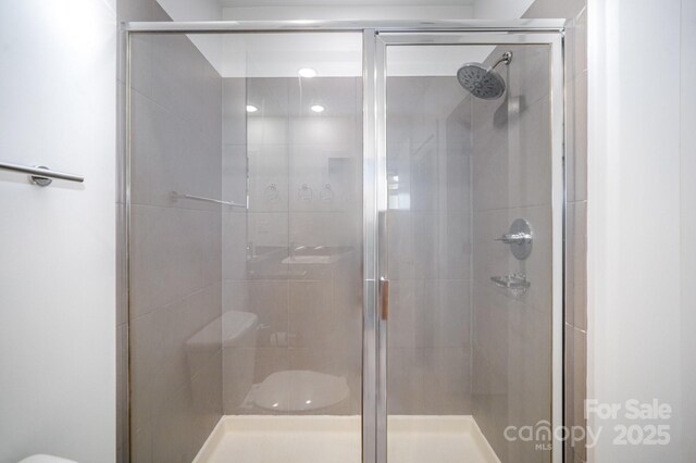 333 W Trade St Unit 1802, Charlotte, NC 28202 - bathroom with toilet and a shower stall