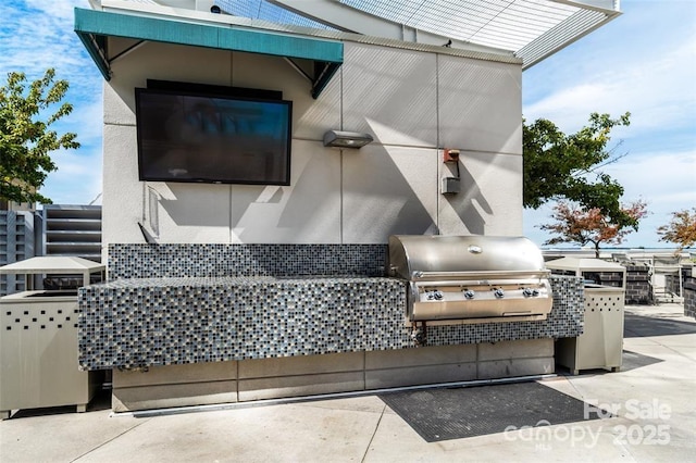 333 W Trade St Unit 1802, Charlotte, NC 28202 - view of patio with grilling area and an outdoor kitchen