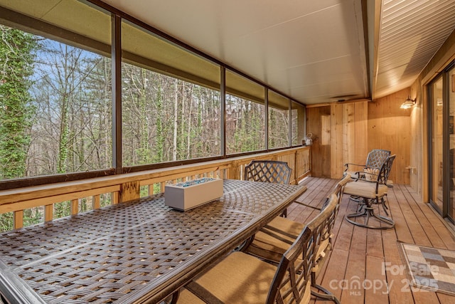 sunroom / solarium with outdoor dining space