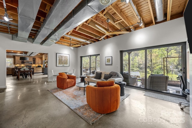 living area with concrete flooring