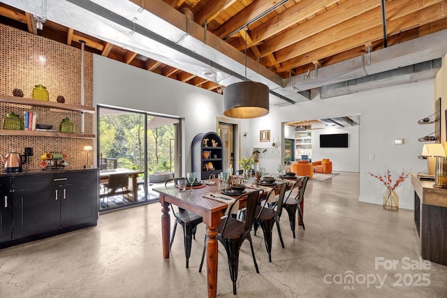 dining space with concrete floors