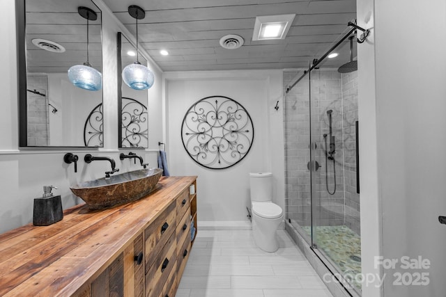 bathroom with toilet, visible vents, recessed lighting, a shower stall, and vanity