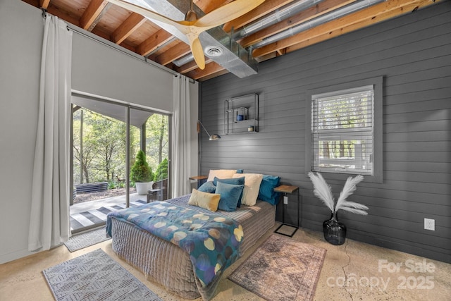 bedroom featuring visible vents, wood walls, access to outside, concrete flooring, and ceiling fan