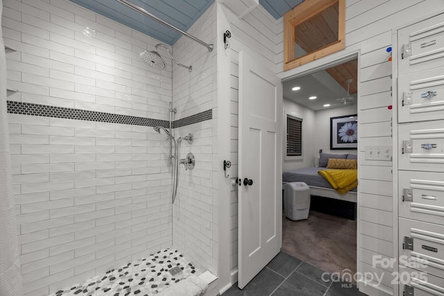 bathroom featuring recessed lighting, tile patterned flooring, tiled shower, and ensuite bathroom