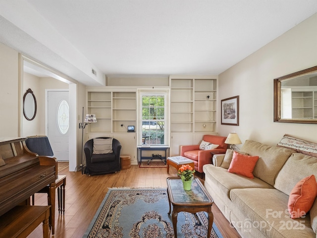 2248 Lawton Bluff Rd, Charlotte, NC 28226 - living room with hardwood / wood-style floors and built in shelves