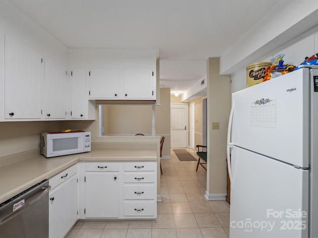 2248 Lawton Bluff Rd, Charlotte, NC 28226 - kitchen featuring white appliances, white cabinets, and light tile patterned flooring