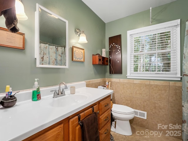 2248 Lawton Bluff Rd, Charlotte, NC 28226 - full bath with vanity, tile walls, tile patterned floors, and a wainscoted wall