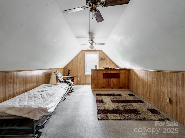2248 Lawton Bluff Rd, Charlotte, NC 28226 - bedroom featuring wooden walls, light carpet, and vaulted ceiling