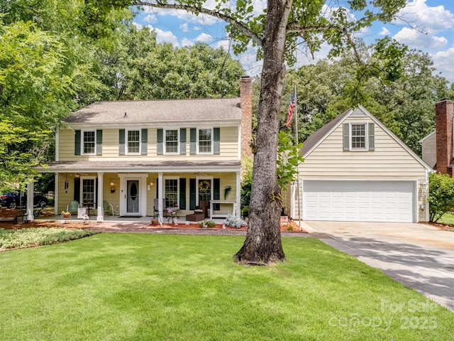 2248 Lawton Bluff Rd, Charlotte, NC 28226 - colonial home with a garage, driveway, a chimney, and a front lawn