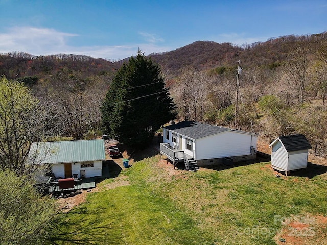 bird's eye view featuring a mountain view and a view of trees