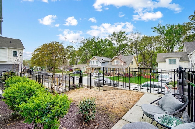 view of yard featuring a residential view and fence