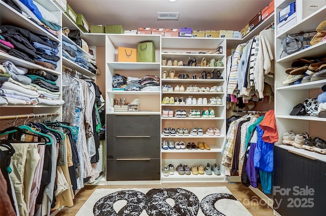 spacious closet featuring visible vents