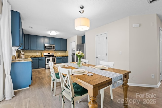 512 Red Oak Ct, Tega Cay, SC 29708 - dining area featuring baseboards, light wood-style floors, and visible vents