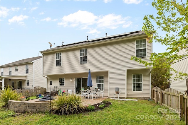 512 Red Oak Ct, Tega Cay, SC 29708 - rear view of house with a patio, a fenced backyard, solar panels, and a yard