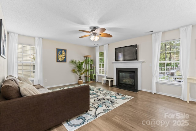 512 Red Oak Ct, Tega Cay, SC 29708 - living room with a wealth of natural light, visible vents, wood finished floors, and ceiling fan
