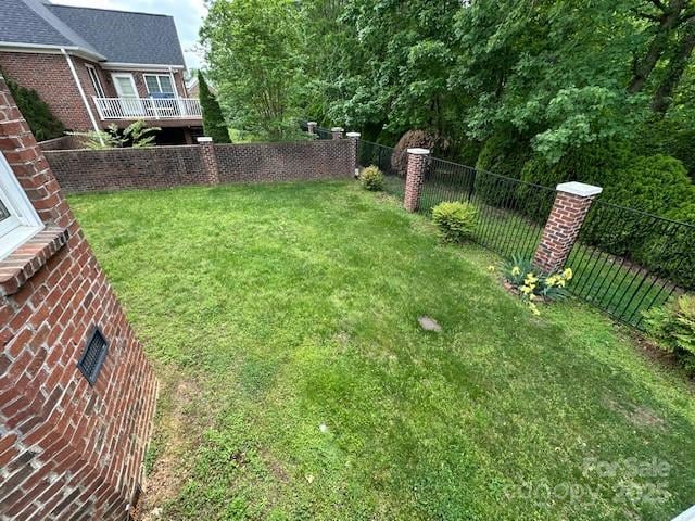 view of yard with a fenced backyard