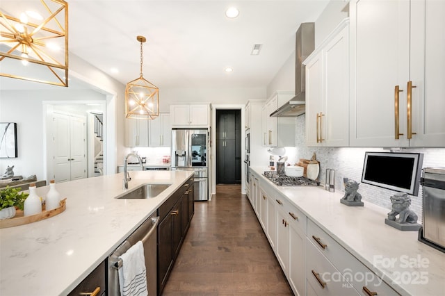 2332 Paddlers Cove Dr, Lake Wylie, SC 29710 - kitchen with hanging light fixtures, a sink, wall chimney range hood, appliances with stainless steel finishes, and backsplash