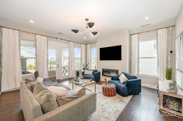 2332 Paddlers Cove Dr, Lake Wylie, SC 29710 - living area featuring french doors, a glass covered fireplace, dark wood-style floors, and visible vents
