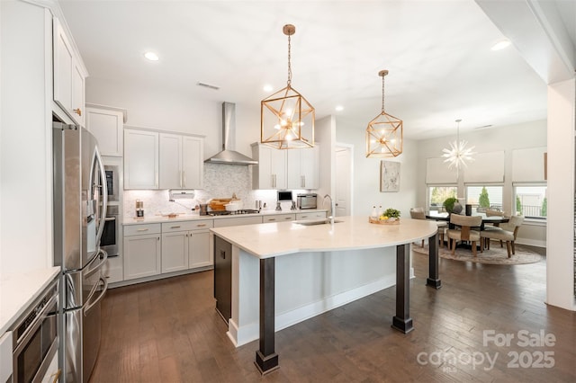 2332 Paddlers Cove Dr, Lake Wylie, SC 29710 - kitchen with wall chimney range hood, backsplash, dark wood finished floors, and stainless steel appliances