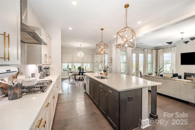 2332 Paddlers Cove Dr, Lake Wylie, SC 29710 - kitchen with tasteful backsplash, a notable chandelier, recessed lighting, wall chimney exhaust hood, and a sink